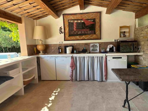 Rustic kitchen with exposed beams at Magnanerie de Sainte Croix B&B, Saint Hippolyte de Caton