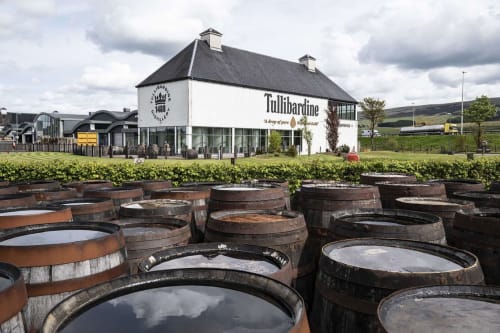 Tullibardine whisky distillery with barrel vats in foreground, Perth Scotland