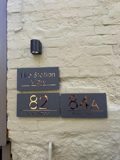 Fire Station View building address plaques at 82 and 84A Fore Street, Exeter, for 2 Doves Holiday Property
