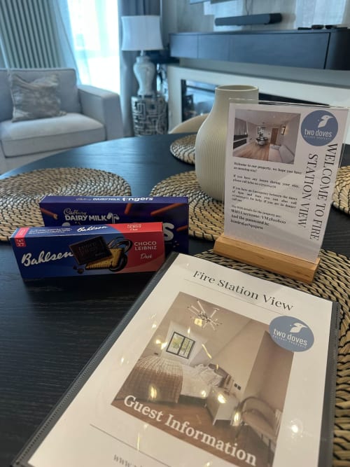 Guest welcome package at 2 Doves Holiday Property in Exeter with brochures, chocolates and welcome information