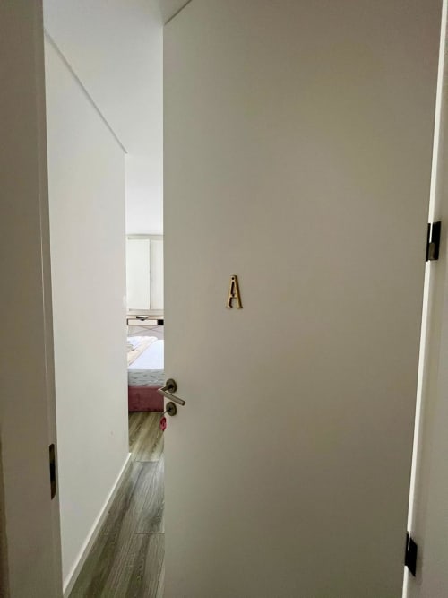 Casa Augusta hostel room C6 Suite A in Braga with hallway, wooden flooring, and city view access