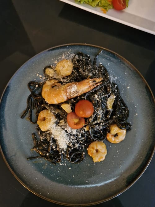 Gourmet squid ink pasta with shrimp and cherry tomatoes at Quinta dos Lobos Boutique Hotel, Sintra