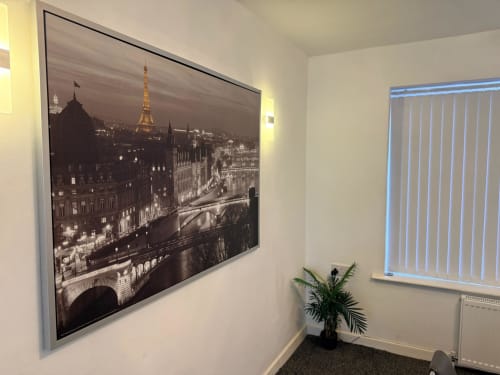 Elegant Paris nighttime skyline photograph with Eiffel Tower displayed in modern frame at Leeds Luxurious Stays villa in