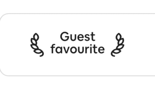 Guest favourite badge with decorative leaf elements for 2 Doves Holiday Property villa in Topsham