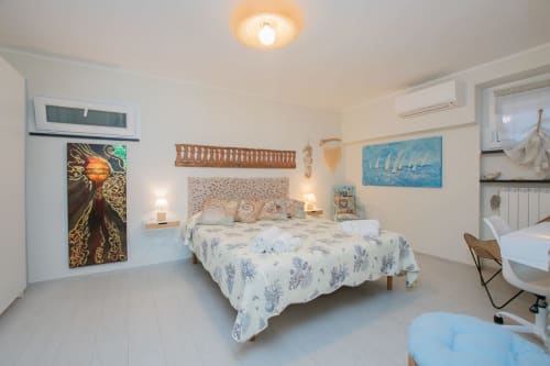 Camera Ancora del Welcome Varigotti con vista mare, letto, aria condizionata e comfort moderni a Varigotti, Italia