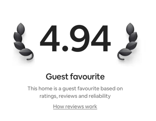4.94 guest favorite rating badge with laurel wreaths for Church View Topsham villa