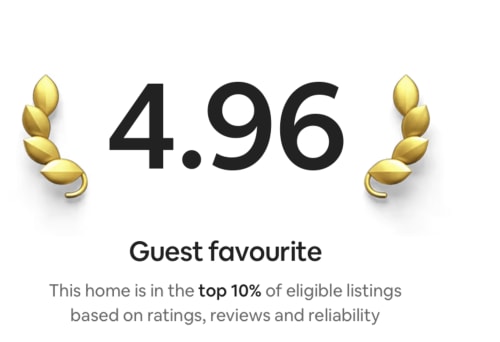 4.96 Guest favourite rating badge with gold laurel wreaths for 2 Doves Holiday Property in Exeter