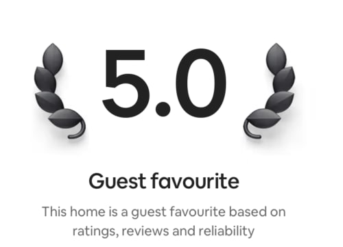 5.0 Guest favourite rating badge with laurel wreaths for 2 Doves Holiday Property in Exeter