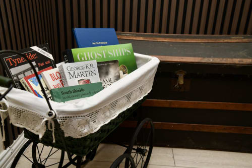 White basket on pram containing books including Ghost Ships at Love Short Stays South Shields hotel