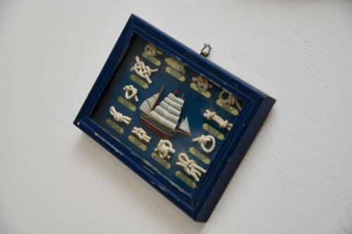 Nautical wall art in navy frame featuring ship and rope knots at Love Short Stays, South Shields