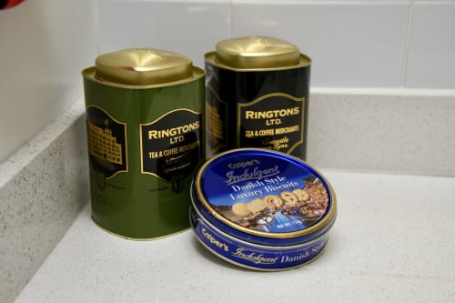 Ringtons tea and coffee tins with Danish biscuits in Love Short Stays apartment kitchen amenities