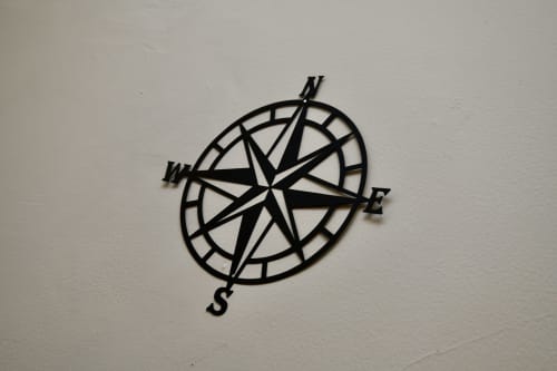 Black compass rose wall decoration at Love Short Stays hotel in South Shields
