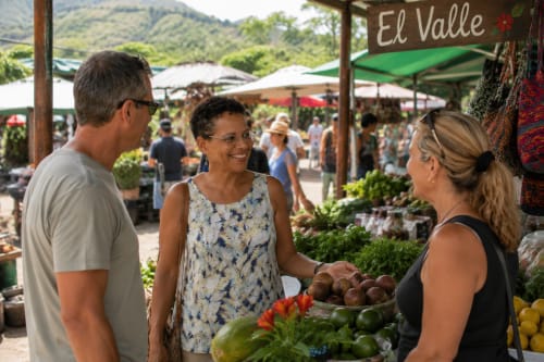 Visitors browse fresh produce at El Valle market near El Litoral Wellness Retreat in Panama