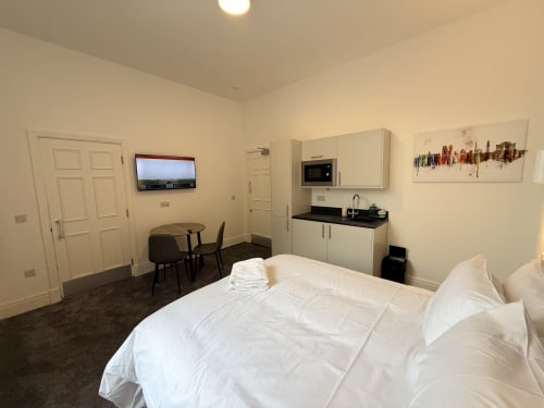 Standard Studio at Fishergate Residences Preston with bed, kitchenette, desk, TV, and dining area