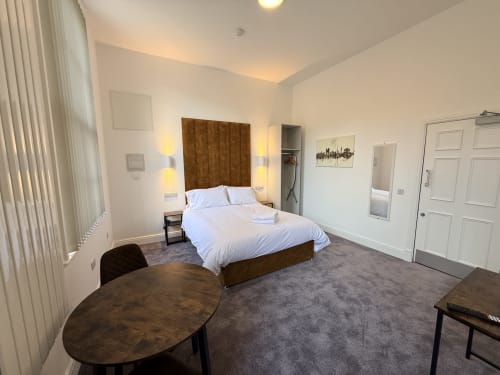 Deluxe Studio at Fishergate Residences Preston with king size bed, neutral decor, desk, and modern amenities