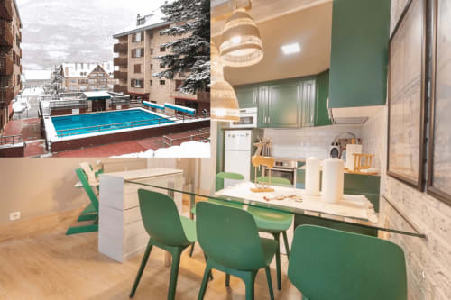 Apartamento moderno en Vielha con cocina verde y blanca, comedor y vistas a piscina nevada