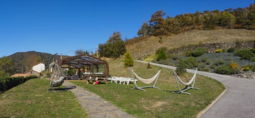 Jardín de Casa Rural Posada Real con hamacas, vistas a la montaña y zona de descanso en Pajares, España