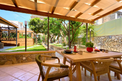 Lemon Garden Escape villa at Sorrento Sea View with wooden pergola, dining table, and Mediterranean garden views in Piano di
