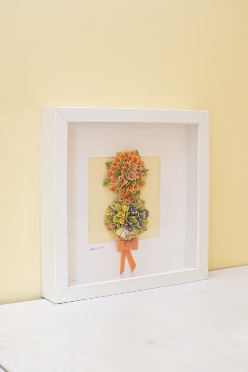 Framed quilled flower bouquet art in white frame at RH Charming Apartments Braga