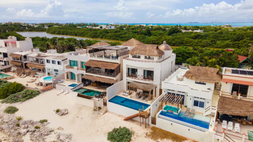 Beachfront villas with private pools overlooking the ocean and lagoon in Isla Mujeres, Mexico