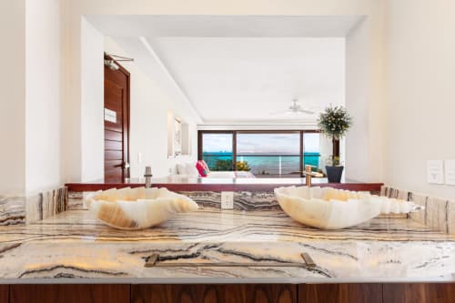 Luxury villa kitchen with marble countertops overlooking turquoise Caribbean Sea, Isla Mujeres Mexico resort