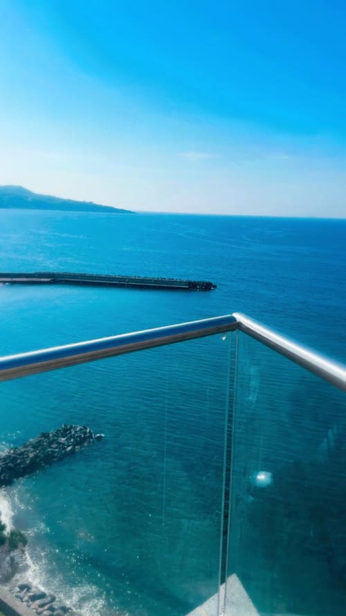 Turquoise Mediterranean Sea view from balcony at Sorrento Sea View hotel, Meta, Italy