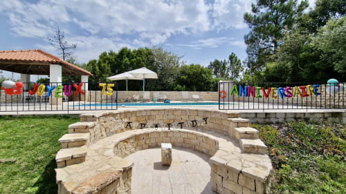 Quinta Boa Vida pool area with fire pit and colorful anniversary banner, Alcobaça cottage retreat
