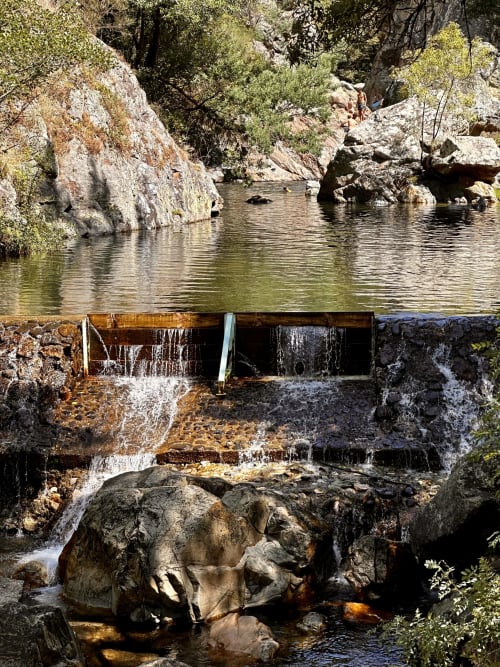 Natural water cascade and pool at Quinta Boa Vida, Alcobaça - garden view with rocky landscape