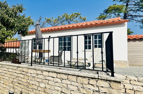 Romantic Chalet Villa at Quinta Boa Vida in Alcobaça with terrace, white walls, terracotta roof, and stone wall foundation