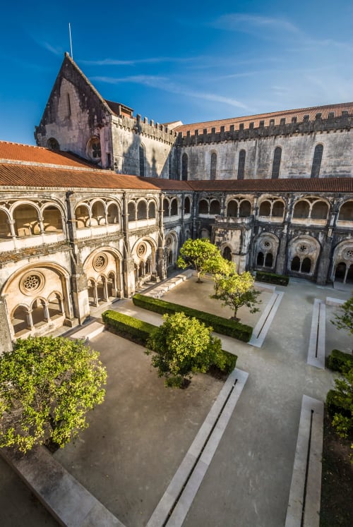 Medieval monastery cloister courtyard with arched colonnades at Quinta Boa Vida, Alcobaça Portugal