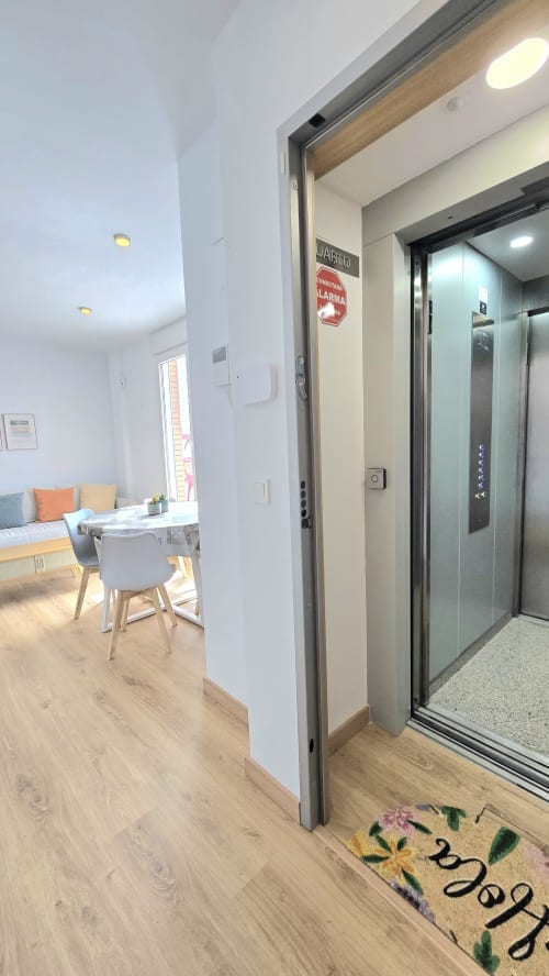 Modern apartment hallway with elevator entrance at Mediterranea Sunny Keys, Benicàssim