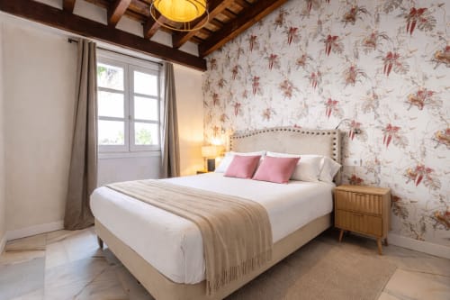 Modern bedroom in SherryLola Cathedral apartment, Jerez de la Frontera, with floral wallpaper and garden view