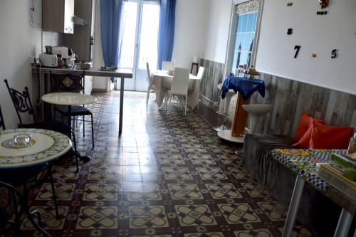 Lavanda room at I colori della Sicilia B&B in Caltagirone with decorative tile floor, dining area, kitchenette, and landmark