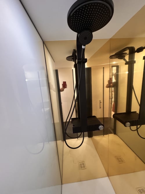 Modern black rainfall showerhead in wet room of Gîte Les Oliviers d'Ardèche cottage in Chalencon, France