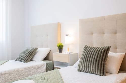 Twin bedroom at Haus Holiday Homes, Los Alcázares with beige headboards, striped pillows and sea view