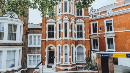 Historic red brick Victorian building with white trim, Wellington House in Nottingham, UK