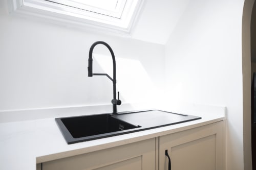 Modern black kitchen sink and faucet in The Oriel Loft apartment at Stay at Wellington Circus, Nottingham