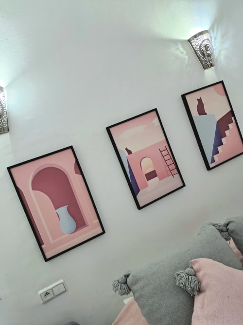 Three framed minimalist artworks on white wall in Vent Des Dunes hotel room, Essaouira