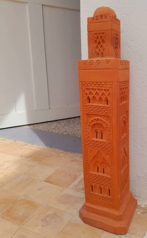 Ornate terracotta minaret sculpture in Essaouira hotel hallway with Moroccan architectural details
