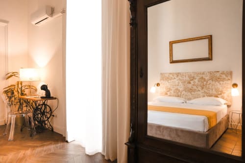 Casa Beretti King Superior room in Catania with wooden flooring, bed with textured headboard, and modern amenities