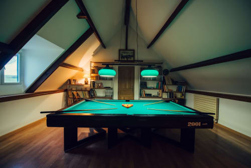 Billiard room at Clos Céleste with turquoise pool table, bookshelves, and pitched beams in Etretat