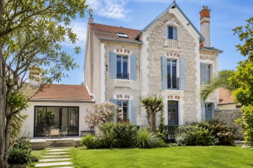 ARLOÉ hotel in La Rochelle: elegant stone villa with blue shutters, manicured garden, and modern terrace
