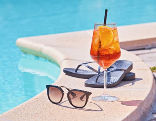 Refreshing tropical cocktail by the pool at Clos Céleste, an Etretat bed and breakfast in Normandy, France