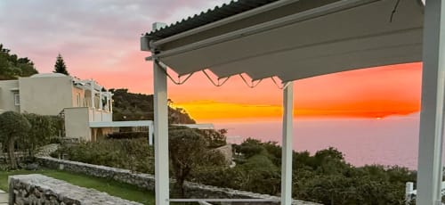 Sunset view from Villa D'Alessandro terrace in Anacapri, Capri with pergola, private garden, and sea view