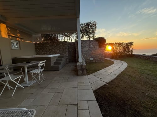 Villa D Alessandro private apartment terrace at sunset with jacuzzi, sea view, and coastal landscape in Anacapri