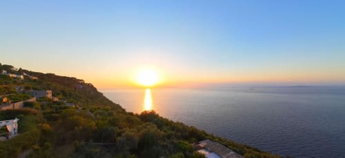 Sunset over the Tyrrhenian Sea from Villa D'Alessandro in Anacapri with coastal clifftop villa and Mediterranean landscape