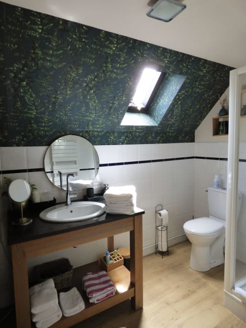 Modern bathroom in La Suite de l'Orangerie duplex at Les Rives De La Tronne hotel, France