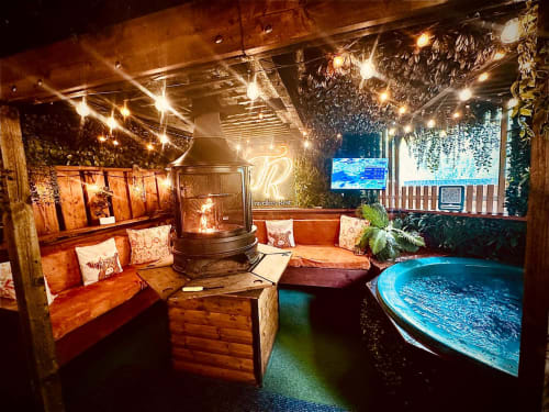 Luxury glamping villa at Four Seasons with heated pool, fireplace, cozy seating, and lake views in Preston