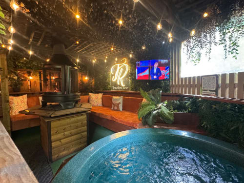 Travellers Rest villa at Four Seasons Glamping with hot tub, outdoor seating, string lights, and lake view in Preston