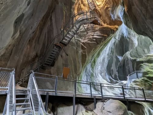 Metal walkway and stairs in dramatic limestone gorge at Hôtel Les Triolets, Châtel